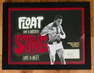 Muhammad Ali "Float Like A Butterfly Sting Like A Bee" with a vintage 1986 autograph.