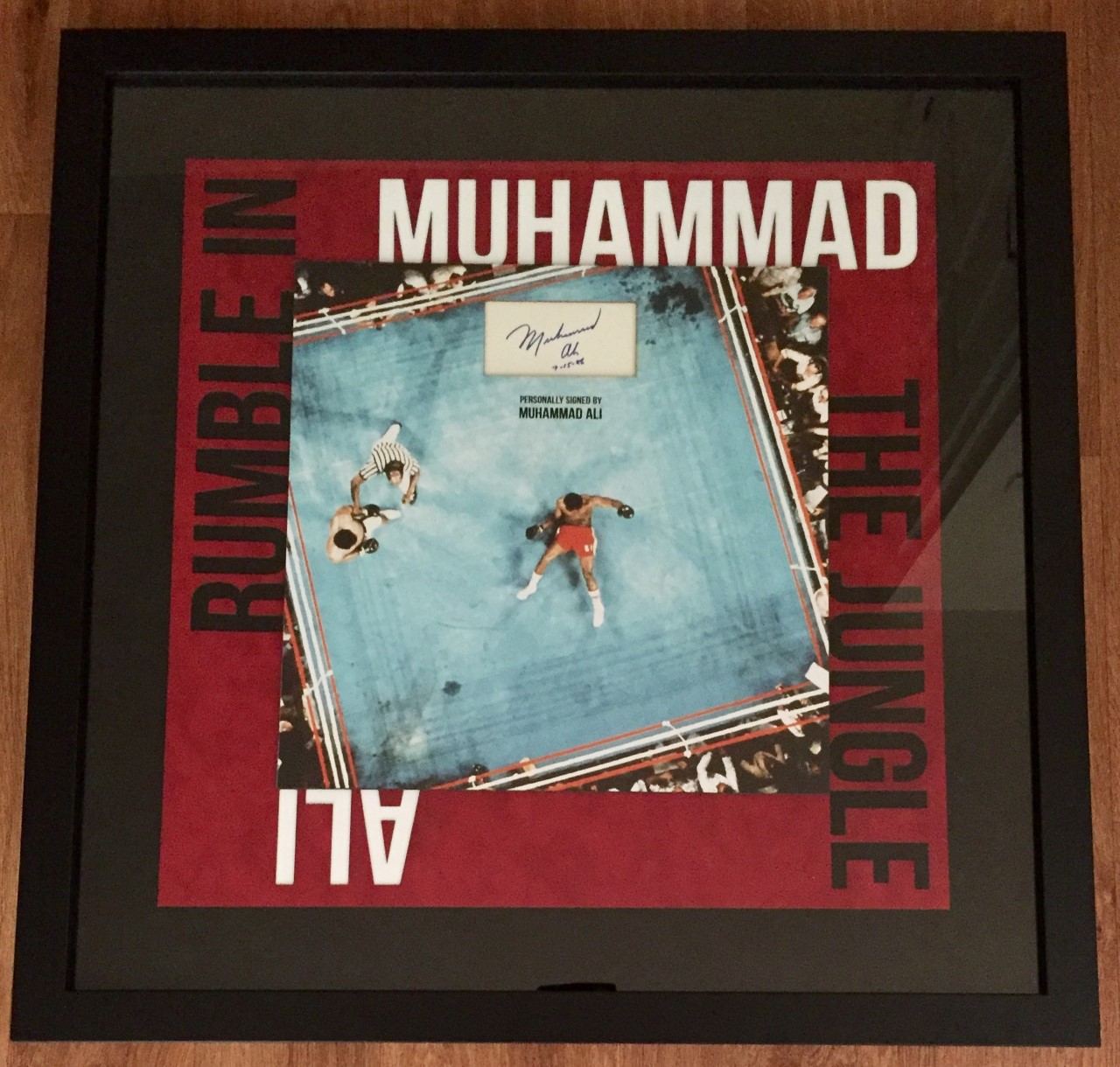 Muhammad Ali vs George Foreman "The Rumble in the Jungle" with a vintage 1986 autograph.